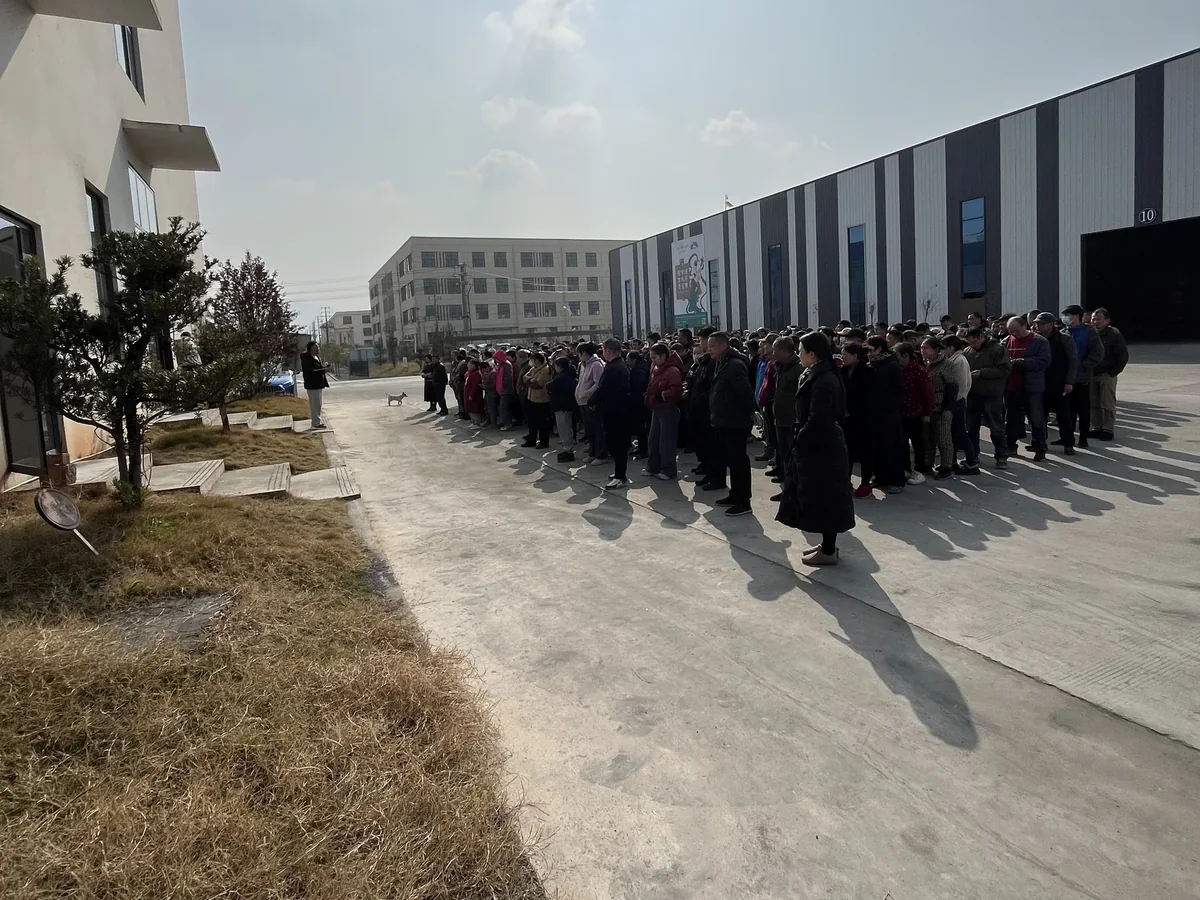 Employees gathered outside the Jiujiang manufacturing campus