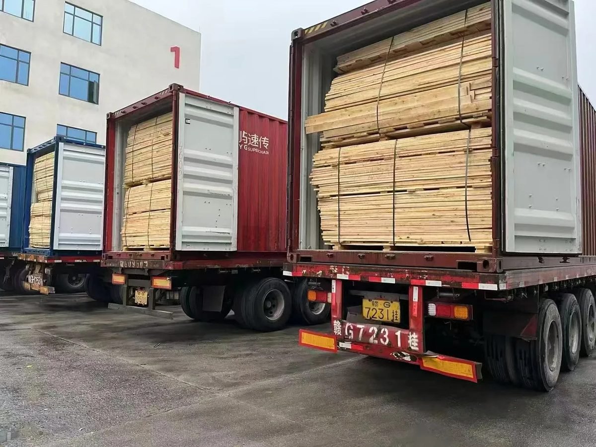 Loaded timber containers in a company-supplied logistics photograph
