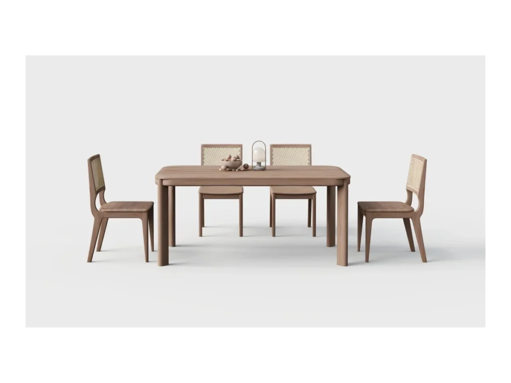 Dining table with four cane-back chairs on a light studio background